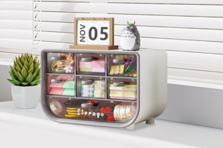 Mini Small Office Desk Organizer with stationery items on it
