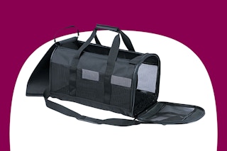 black travel kennel on a maroon and white background