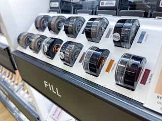 A variety of Anastasia of Beverly Hills Dipbrow tester jars sitting in a display.