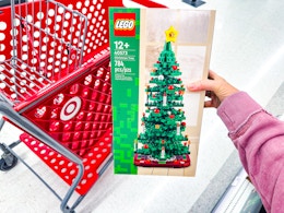 hand holding a lego christmas tree at target