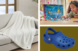 Crocs shoes, a blanket, and a little girl playing with a Lego advent calendar 