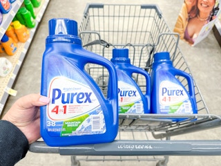 hand holding purex detergent in walgreens