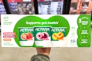 hand holding a box of activia yogurt