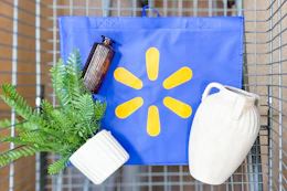 walmart reusable bag with faux plant, vases