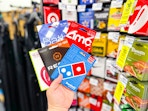 person holding a handful of gift cards