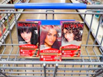 3 revlon hair color boxes sitting in a walmart cart