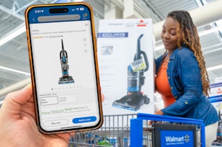 someone looking up the price of a product on the walmart app while their friend is putting the product in a cart