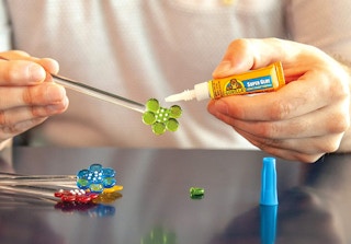 person gluing craft with gorilla glue
