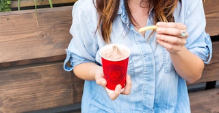 person outside dipping wendys french fry into frosty
