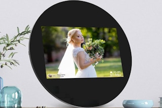 a digital picture frame on a table