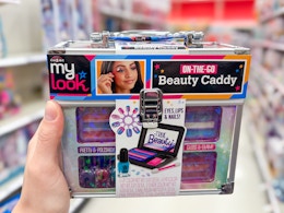 hand holding a my look makeup caddy in a target aisle