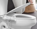 a bidet on a toilet