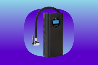A black rectangular tire inflator has a digital display and a tube to attach it to the tire