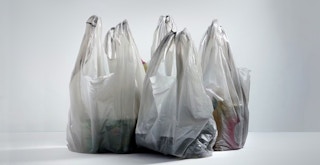 generic plastic shopping bags on gray background feature