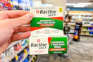 hand holding bactine antibiotic ointment