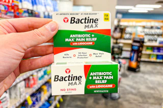 hand holding bactine antibiotic ointment