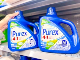 hand pulling a bottle of Purex detergent off a Walmart shelf