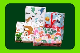 Four gifts are wrapped in cute paper: sloths, snowmen, socks, and dinosaurs.