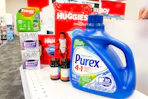 purex detergent, huggies diapers, olay moisturizer, zyrtec allergy medication, and cvs health vitamins on a shelf