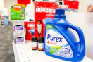 purex detergent, huggies diapers, olay moisturizer, zyrtec allergy medication, and cvs health vitamins on a shelf