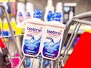 2 bottles of biotene mouthwash in a cart