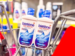 2 bottles of biotene mouthwash in a cart