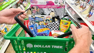 a person holding a dollar tree basket with brand name items inside