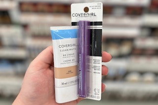 hand holding covergirl bb cream and mascara at walgreens store