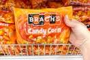hand holding a brach's halloween candy corn bag