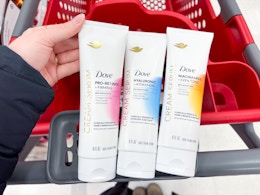 3 dove cream serums sitting on top a target cart