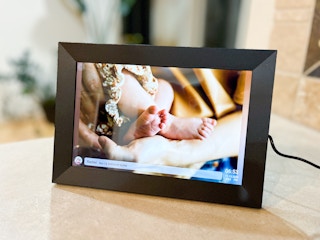 a digital picture frame on a table