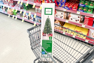 christmas tree in box inside cart
