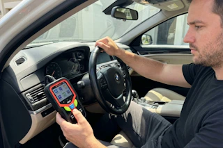 a man using a diagnostic tool