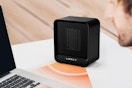 Lerat Electric Space Heater sitting on a desk next to a laptop.