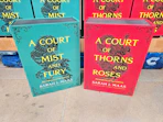 2 acotar throw blankets sitting in front a display at sam's club