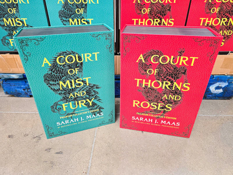 2 acotar throw blankets sitting in front a display at sam's club