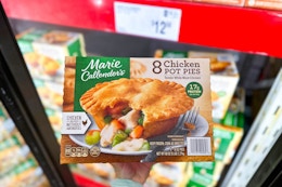 hand holding a pack of marie callenders pot pies