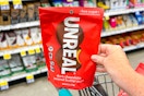 hand holding a bag of unreal chocolate peanut butter cups