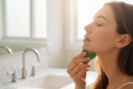 a woman using a gua sha
