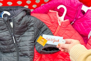 cat & jack puffer coats sitting in a target cart