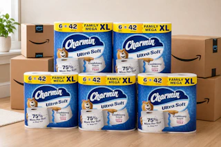 packs of toilet paper in front of Amazon boxes
