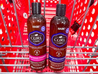 two bottles of Hask shampoo in store cart