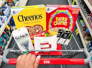 shopping cart with Cheerios cereal, Lucky Charms cereal, Schick razor, L'Oreal Paris Revitalift makeup remover wipes, and two Covergirl ...