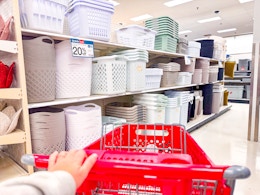 target cart sitting in front of laundry baskets and hampers