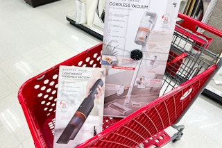 Sharper Image stick vacuum and handheld vacuums in a red Target card