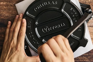 tortilla press being used