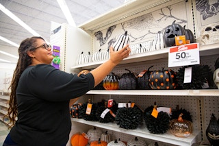 Person shopping looking at pumpkins in side a Joann's Fabrics
