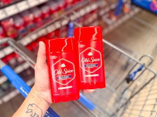 2 Old Spice deodorants held above Walmart shopping cart