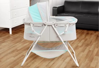 blue and gray bassinet in a living room