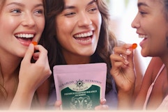 women eating a feminine balance gummies